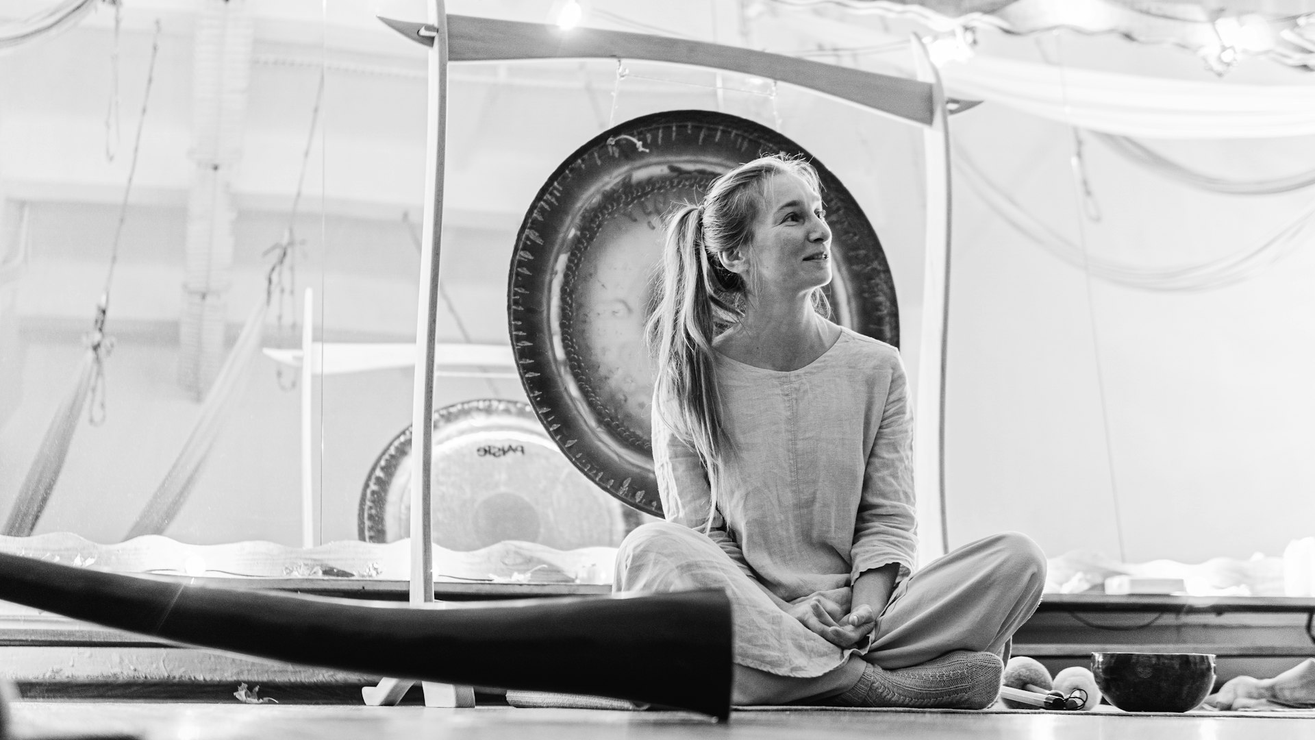 a woman sitting on the floor in a room
